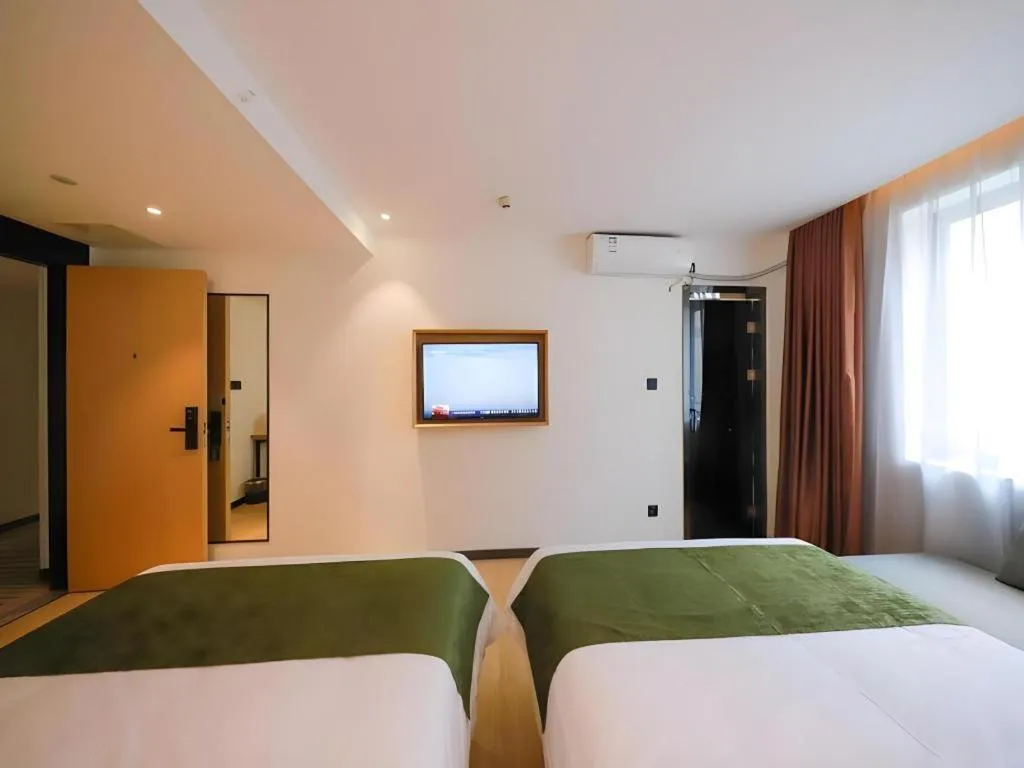 Bed in Green Tree Inn Guangxi Wuzhou 2nd Xinxing Road Liangguang Market