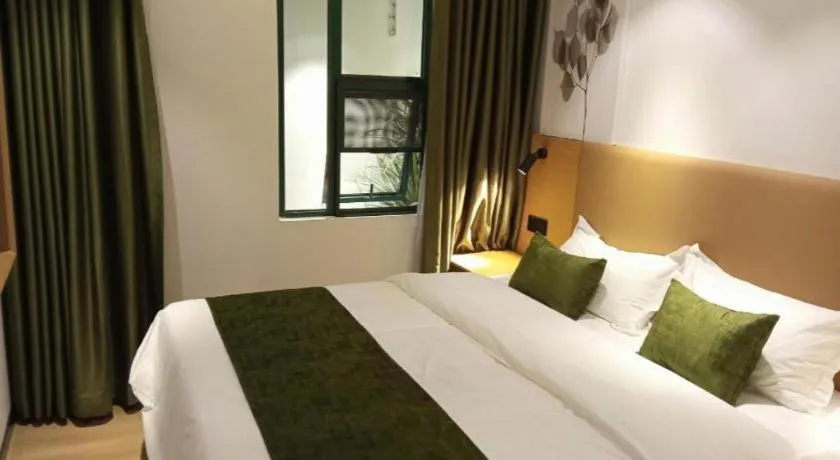 Bed in Green Tree Inn Guangxi Wuzhou 2nd Xinxing Road Liangguang Market