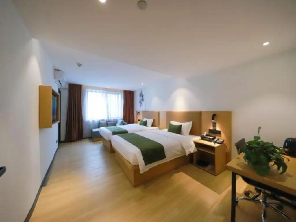 Bed in Green Tree Inn Guangxi Wuzhou 2nd Xinxing Road Liangguang Market