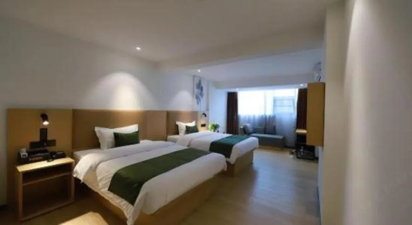 Bed in Green Tree Inn Guangxi Wuzhou 2nd Xinxing Road Liangguang Market