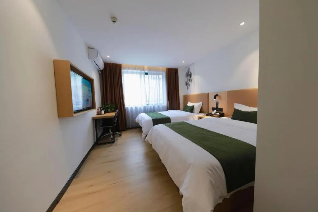 Bed in Green Tree Inn Guangxi Wuzhou 2nd Xinxing Road Liangguang Market