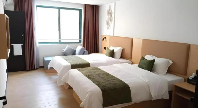 Bed in Green Tree Inn Guangxi Wuzhou 2nd Xinxing Road Liangguang Market