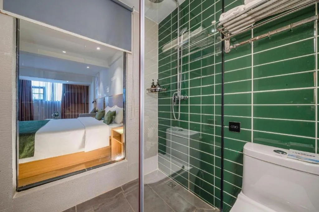 Bed in Green Tree Inn Guangxi Wuzhou 2nd Xinxing Road Liangguang Market