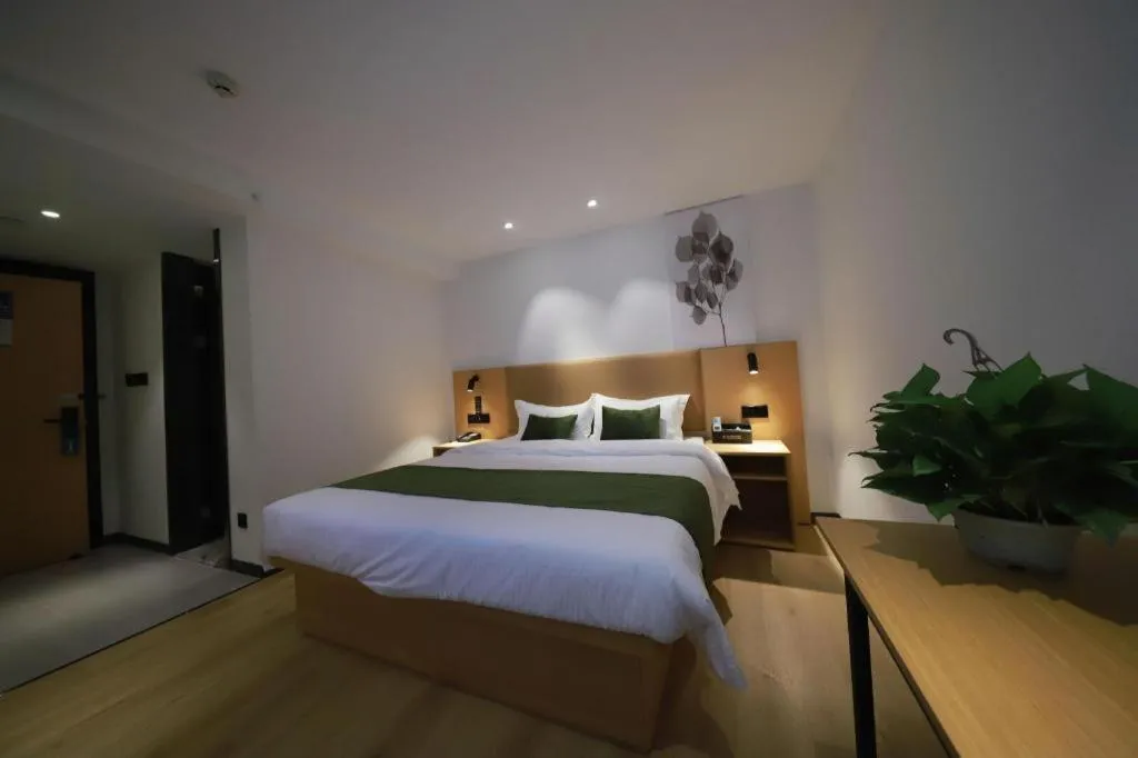 Bed in Green Tree Inn Guangxi Wuzhou 2nd Xinxing Road Liangguang Market