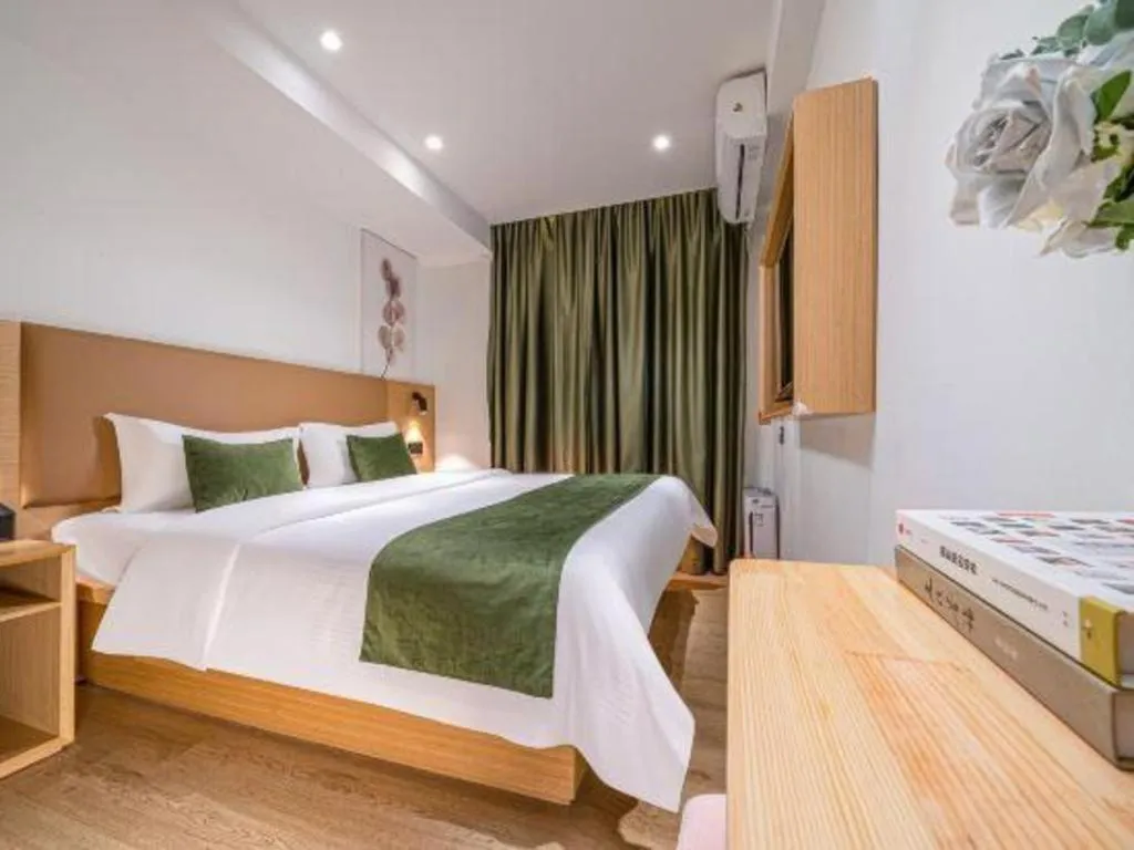 Bed in Green Tree Inn Guangxi Wuzhou 2nd Xinxing Road Liangguang Market