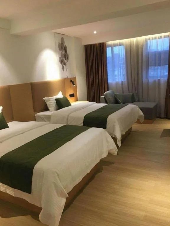 Bed in Green Tree Inn Guangxi Wuzhou 2nd Xinxing Road Liangguang Market