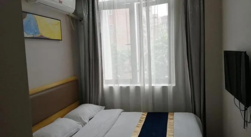 Bed in Shell Hotel Shanghai Normal University Hongcao Road Metro Station Guiping Road