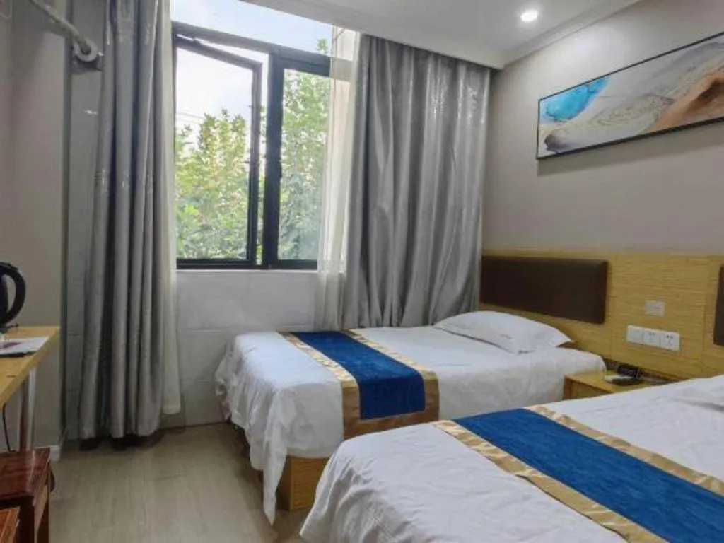 Bed in Shell Hotel Shanghai Normal University Hongcao Road Metro Station Guiping Road