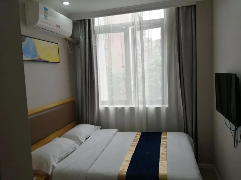 Bed in Shell Hotel Shanghai Normal University Hongcao Road Metro Station Guiping Road