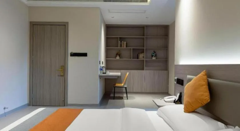 Bed in Shell Hotel Suzhou Zhangjiagang Jingang Town Central Plaza