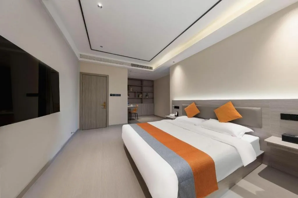 Bed in Shell Hotel Suzhou Zhangjiagang Jingang Town Central Plaza