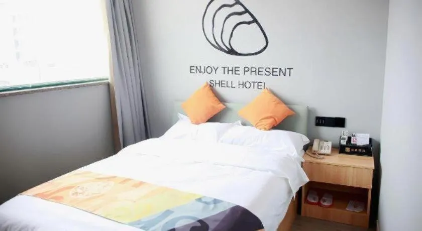 Bed in Shell Hotel Suzhou Zhangjiagang Jingang Town Central Plaza