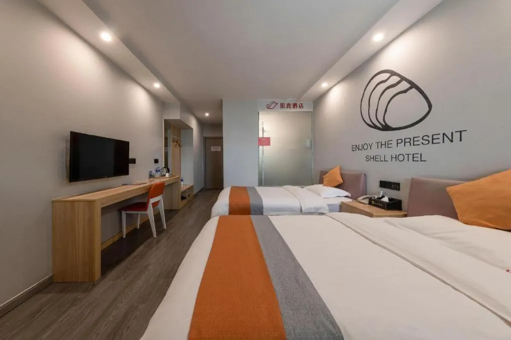 Bed in Shell Hotel Suzhou Zhangjiagang Jingang Town Central Plaza