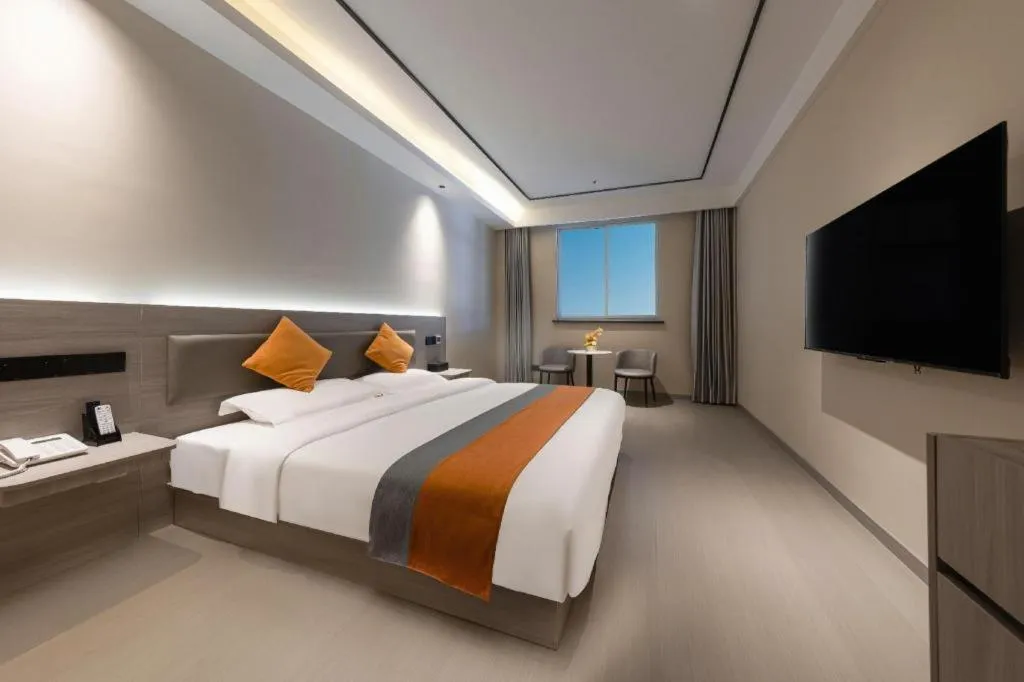 Bed in Shell Hotel Suzhou Zhangjiagang Jingang Town Central Plaza