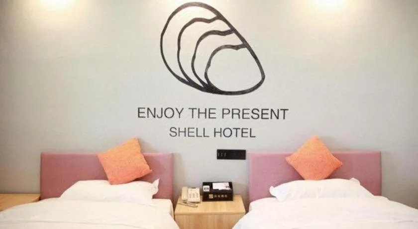 Bed in Shell Hotel Suzhou Zhangjiagang Jingang Town Central Plaza