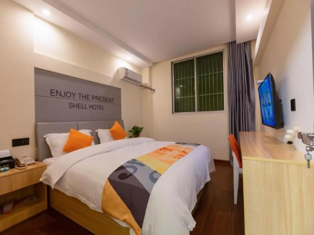 Bed in Shell Hotel Suzhou Zhangjiagang Jingang Town Central Plaza