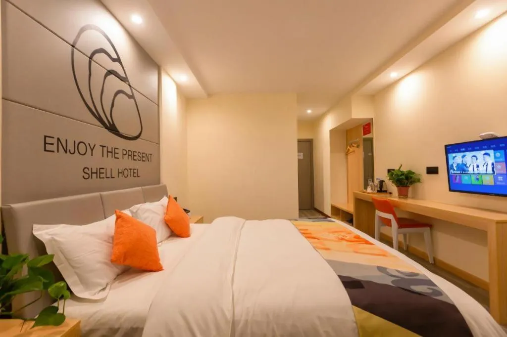 Bed in Shell Hotel Suzhou Zhangjiagang Jingang Town Central Plaza