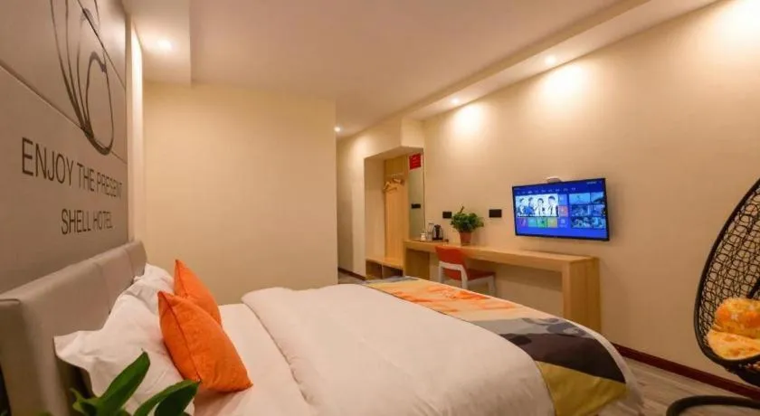 Bed in Shell Hotel Suzhou Zhangjiagang Jingang Town Central Plaza