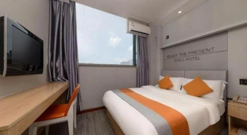 Bed in Shell Hotel Suzhou Zhangjiagang Jingang Town Central Plaza