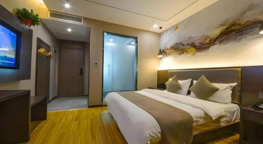 Bed in Shell Hotel Zhengzhou East High-Speed Railway Station Zhengdong Commerical Center