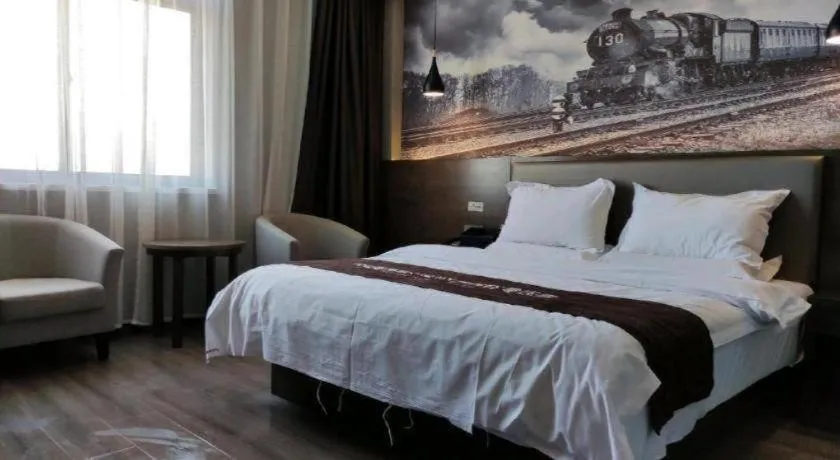 Bed in Shell Hotel Zhengzhou East High-Speed Railway Station Zhengdong Commerical Center