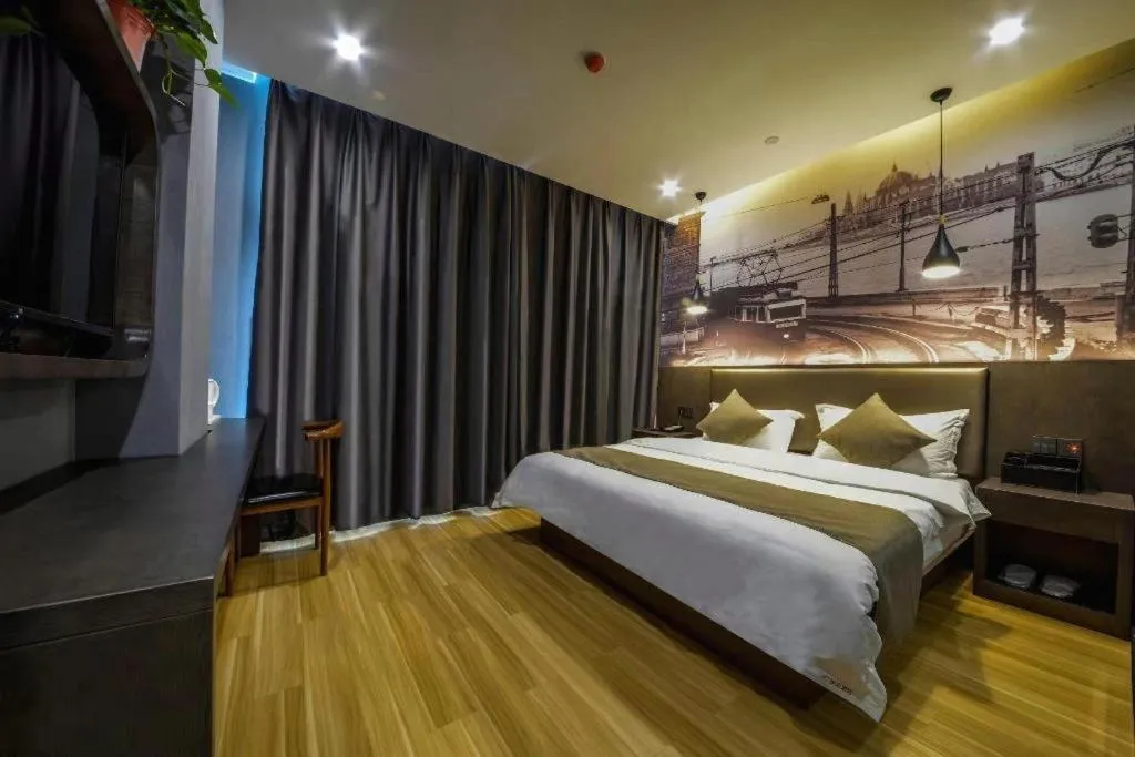 Bed in Shell Hotel Zhengzhou East High-Speed Railway Station Zhengdong Commerical Center