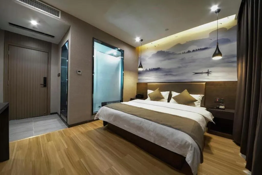 Bed in Shell Hotel Zhengzhou East High-Speed Railway Station Zhengdong Commerical Center