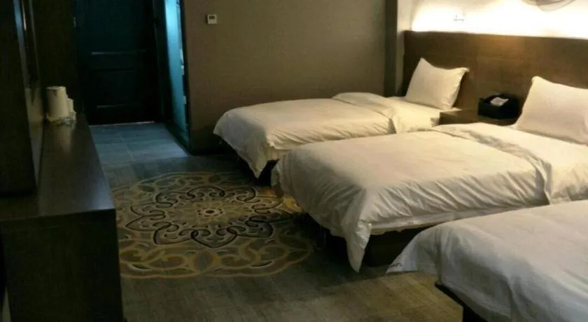 Bed in Shell Hotel Zhengzhou East High-Speed Railway Station Zhengdong Commerical Center