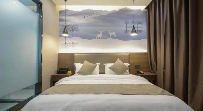 Bed in Shell Hotel Zhengzhou East High-Speed Railway Station Zhengdong Commerical Center