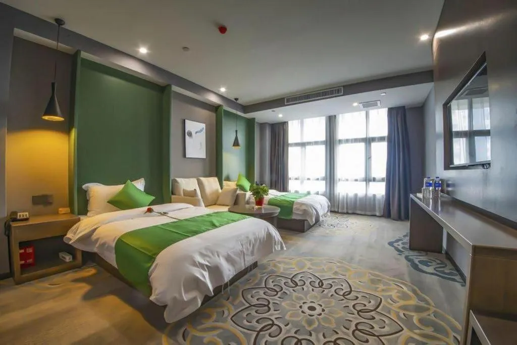 Bed in Shell Hotel Zhengzhou East High-Speed Railway Station Zhengdong Commerical Center