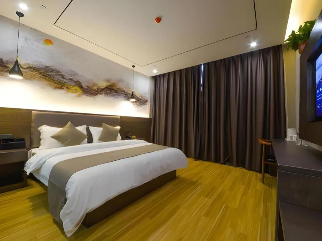 Bed in Shell Hotel Zhengzhou East High-Speed Railway Station Zhengdong Commerical Center