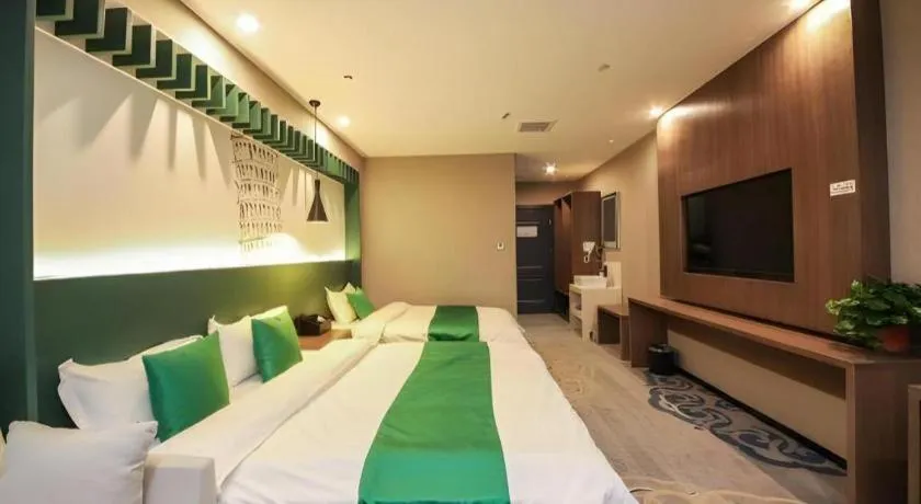 Bed in Shell Hotel Zhengzhou East High-Speed Railway Station Zhengdong Commerical Center