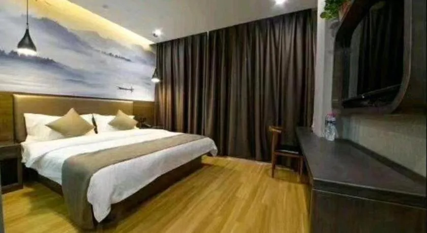Bed in Shell Hotel Zhengzhou East High-Speed Railway Station Zhengdong Commerical Center