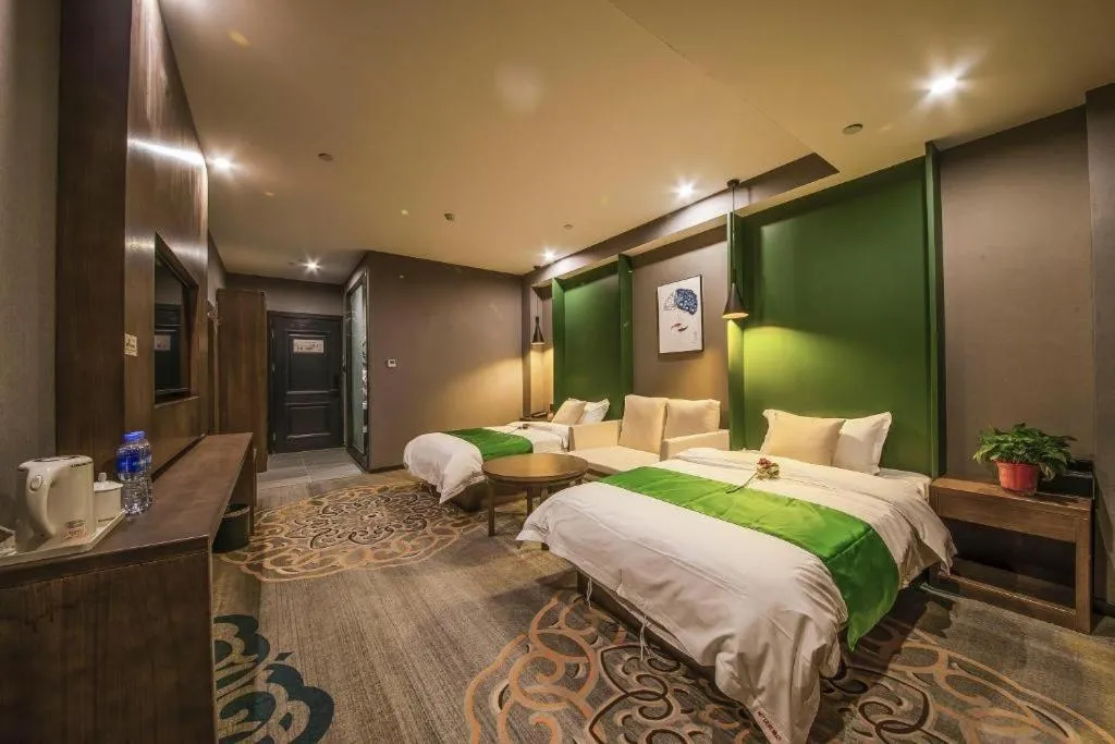 Bed in Shell Hotel Zhengzhou East High-Speed Railway Station Zhengdong Commerical Center