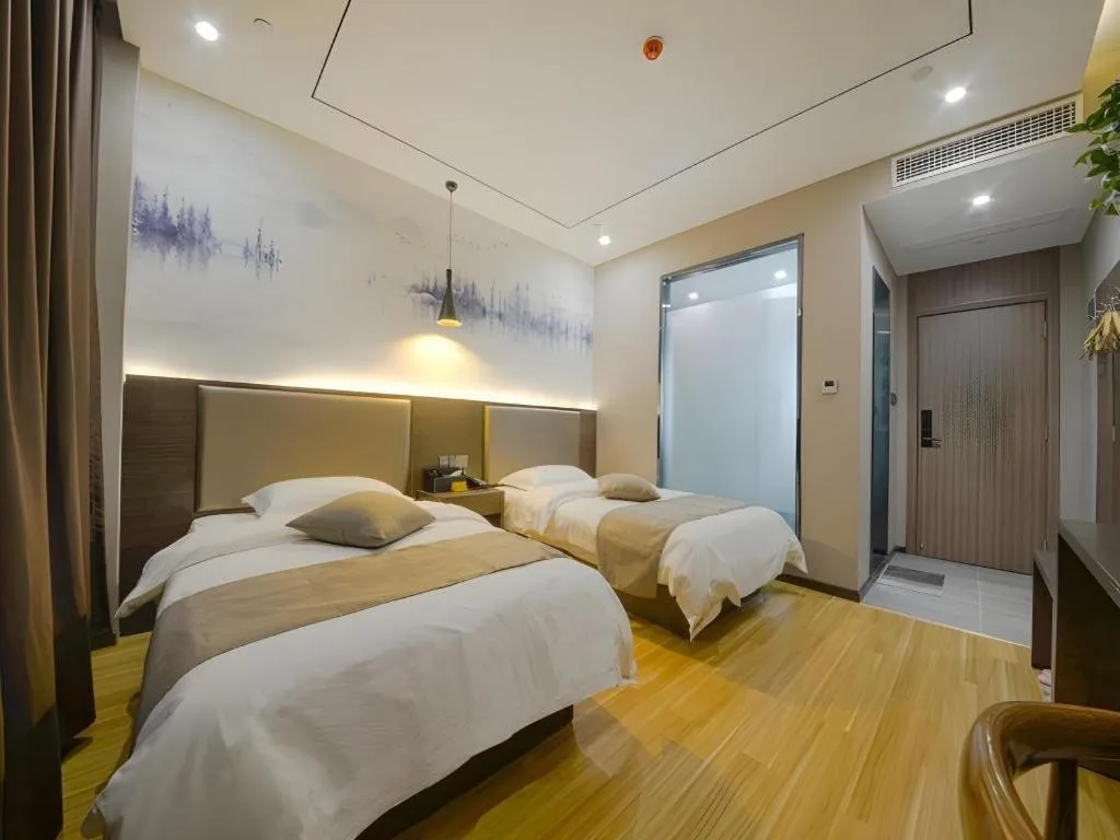 Bed in Shell Hotel Zhengzhou East High-Speed Railway Station Zhengdong Commerical Center