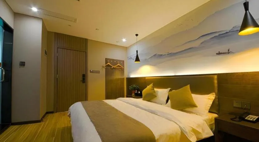 Bed in Shell Hotel Zhengzhou East High-Speed Railway Station Zhengdong Commerical Center