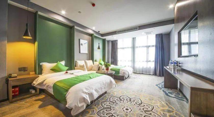 Bed in Shell Hotel Zhengzhou East High-Speed Railway Station Zhengdong Commerical Center