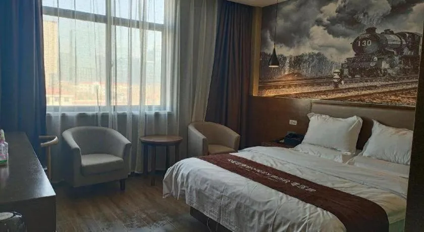 Bed in Shell Hotel Zhengzhou East High-Speed Railway Station Zhengdong Commerical Center