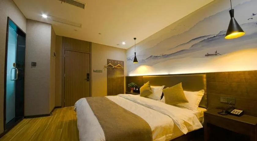Bed in Shell Hotel Zhengzhou East High-Speed Railway Station Zhengdong Commerical Center