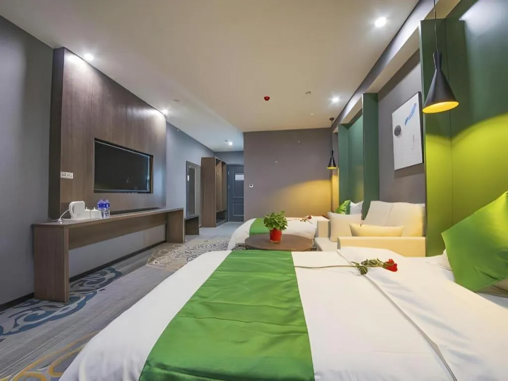 Bed in Shell Hotel Zhengzhou East High-Speed Railway Station Zhengdong Commerical Center