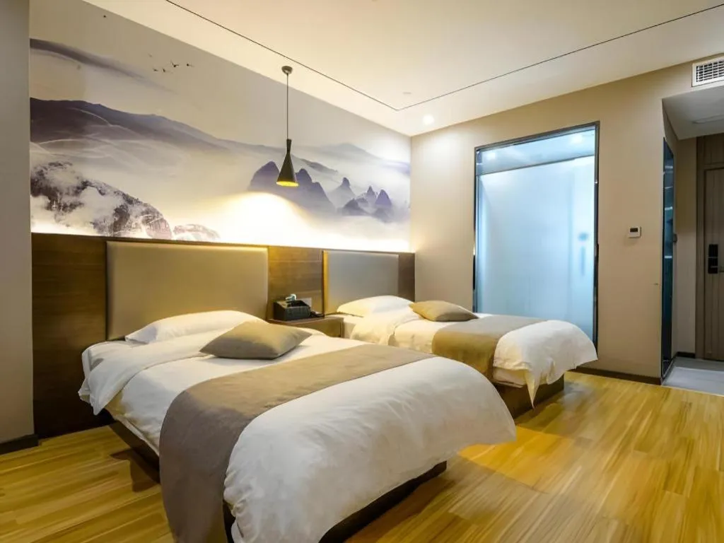 Bed in Shell Hotel Zhengzhou East High-Speed Railway Station Zhengdong Commerical Center