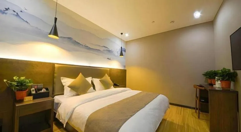 Bed in Shell Hotel Zhengzhou East High-Speed Railway Station Zhengdong Commerical Center