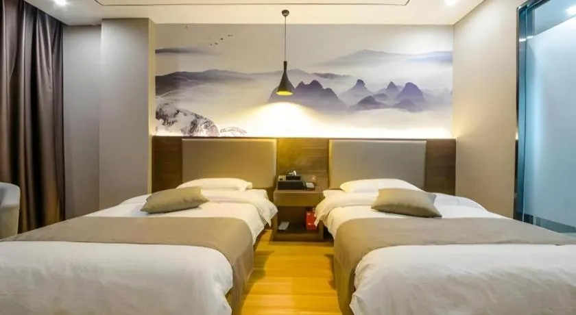 Bed in Shell Hotel Zhengzhou East High-Speed Railway Station Zhengdong Commerical Center