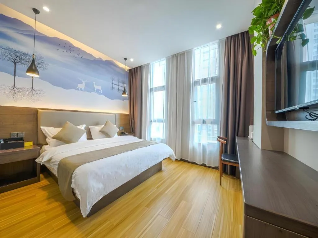 Bed in Shell Hotel Zhengzhou East High-Speed Railway Station Zhengdong Commerical Center