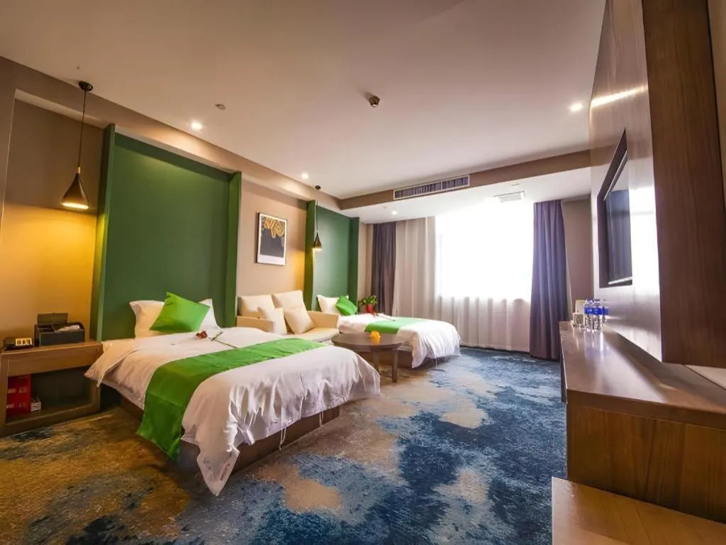 Bed in Shell Hotel Zhengzhou East High-Speed Railway Station Zhengdong Commerical Center