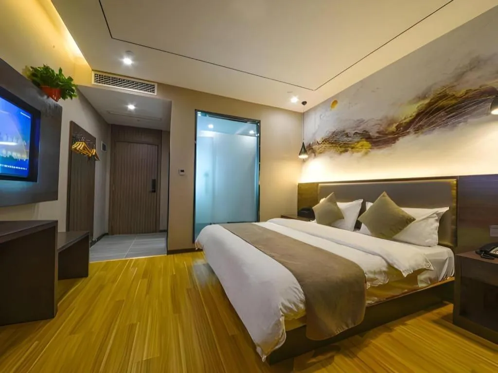 Bed in Shell Hotel Zhengzhou East High-Speed Railway Station Zhengdong Commerical Center