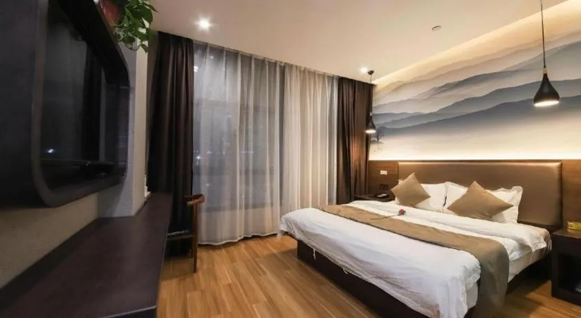 Bed in Shell Hotel Zhengzhou East High-Speed Railway Station Zhengdong Commerical Center