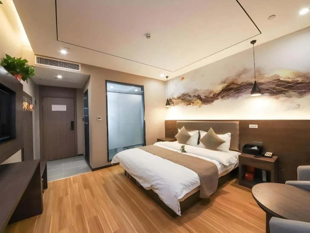Bed in Shell Hotel Zhengzhou East High-Speed Railway Station Zhengdong Commerical Center