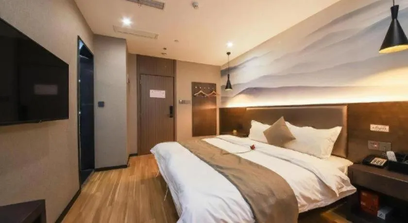 Bed in Shell Hotel Zhengzhou East High-Speed Railway Station Zhengdong Commerical Center