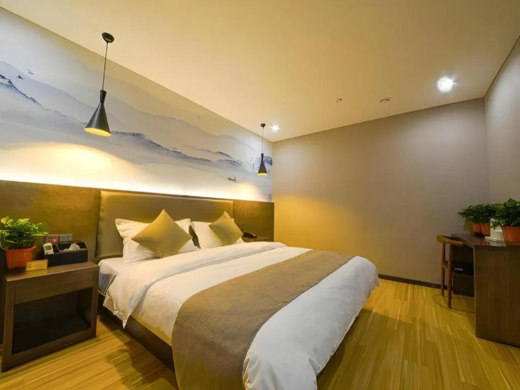 Bed in Shell Hotel Zhengzhou East High-Speed Railway Station Zhengdong Commerical Center